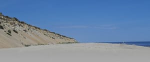 huge sand dunes tower over marconi beach in wellfleet, part of the cape cod national seashore