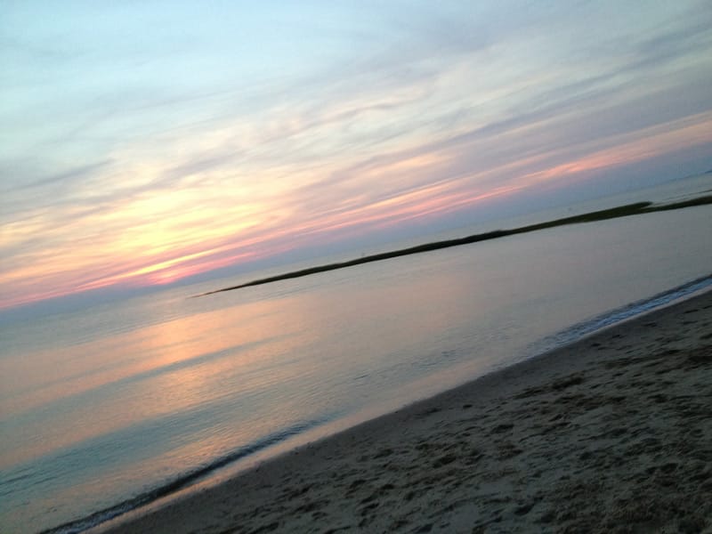 sunset as seen from an oversand beach trail on cape cod