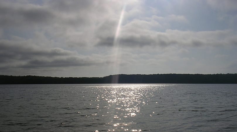 Light reflects of Big Cliff Pond in Brewster