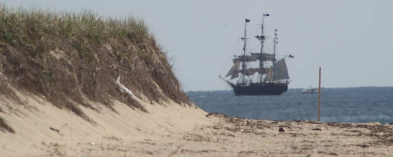 a tall ship passes the orv trails on the north side of race point beach in 2015